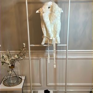 White fur vest